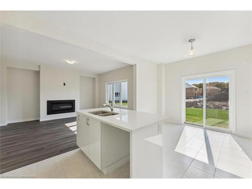 430 Beechwood Forest Lane Lane, Gravenhurst, ON - Indoor Photo Showing Kitchen With Fireplace With Double Sink