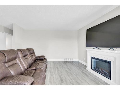 18 Palmer Road, Hamilton, ON - Indoor Photo Showing Living Room With Fireplace