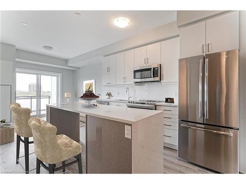 321-128 Grovewood Common, Oakville, ON - Indoor Photo Showing Kitchen With Stainless Steel Kitchen With Upgraded Kitchen