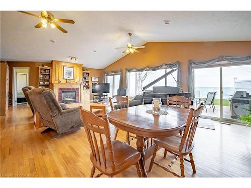 2948 North Shore Drive, Lowbanks, ON - Indoor Photo Showing Dining Room With Fireplace