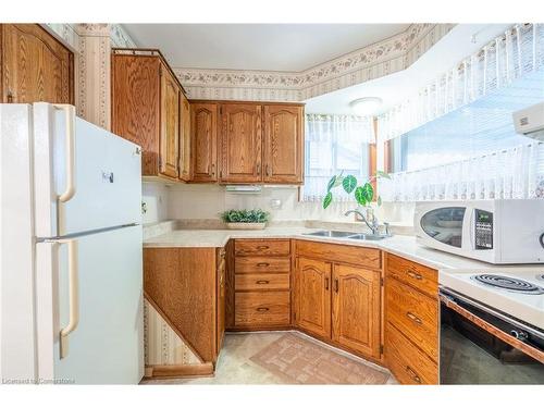 1053 Fennell Avenue E, Hamilton, ON - Indoor Photo Showing Kitchen With Double Sink