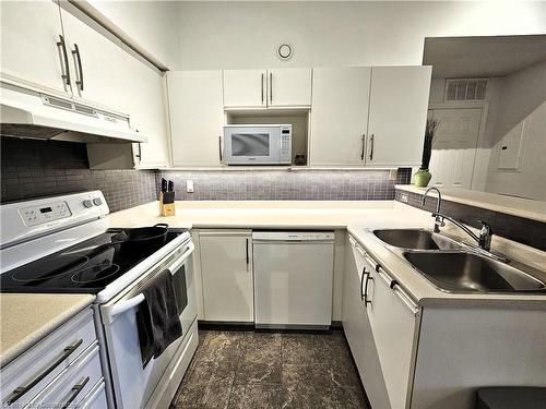 408-4013 Kilmer Drive, Burlington, ON - Indoor Photo Showing Kitchen With Double Sink