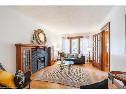 56 Newton Avenue, Hamilton, ON - Indoor Photo Showing Living Room With Fireplace