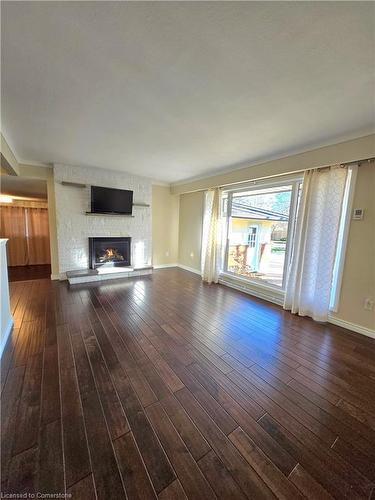 Upper Unit-23 Old Oxford Road, St. Catharines, ON - Indoor Photo Showing Living Room With Fireplace