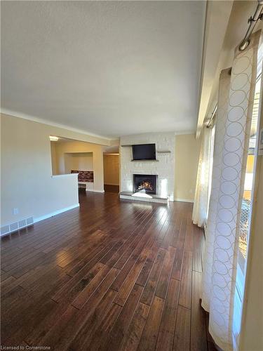 Upper Unit-23 Old Oxford Road, St. Catharines, ON - Indoor Photo Showing Living Room With Fireplace