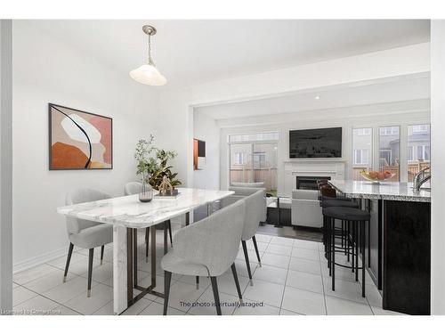 12 Heming Trail Trail, Ancaster, ON - Indoor Photo Showing Dining Room With Fireplace