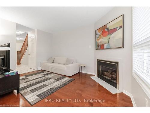 112-2555 Thomas Street, Mississauga, ON - Indoor Photo Showing Living Room With Fireplace