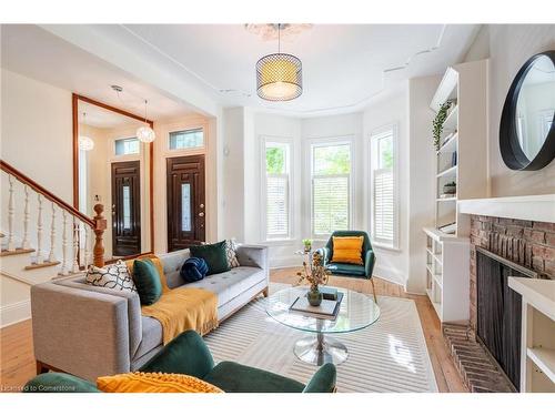 24 Bruce Street, Hamilton, ON - Indoor Photo Showing Living Room With Fireplace