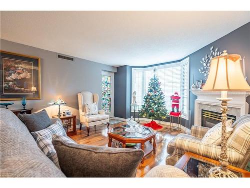 107-980 Golf Links Road, Ancaster, ON - Indoor Photo Showing Living Room With Fireplace