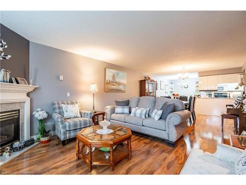 107-980 Golf Links Road, Ancaster, ON - Indoor Photo Showing Living Room With Fireplace