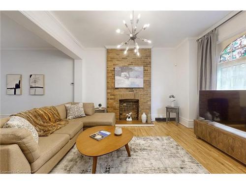 18 Spring Street, Hamilton, ON - Indoor Photo Showing Living Room With Fireplace