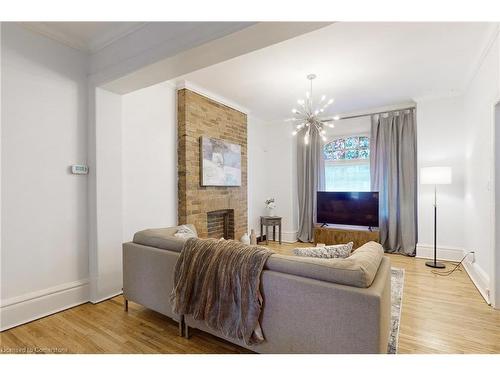 18 Spring Street, Hamilton, ON - Indoor Photo Showing Living Room With Fireplace