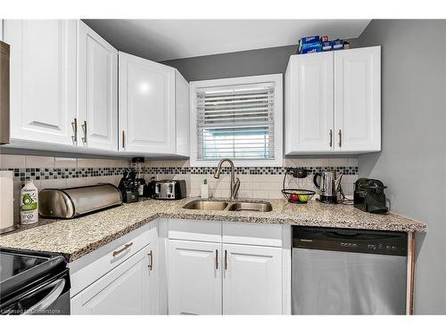 766 Upper Gage Avenue, Hamilton, ON - Indoor Photo Showing Kitchen With Double Sink