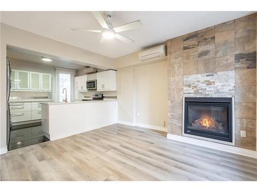 2-138 Bold Street, Hamilton, ON - Indoor Photo Showing Living Room With Fireplace