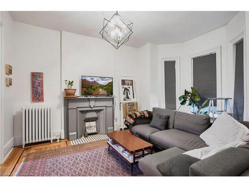 136 East Avenue N, Hamilton, ON - Indoor Photo Showing Living Room With Fireplace