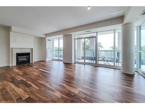 323-11 Bronte Road, Oakville, ON - Indoor Photo Showing Living Room With Fireplace