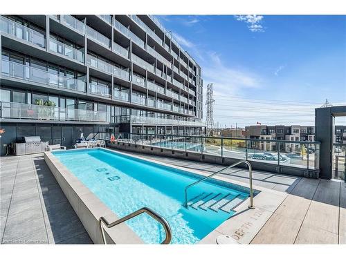 B918-3200 Dakota Common, Burlington, ON - Outdoor With In Ground Pool With Balcony