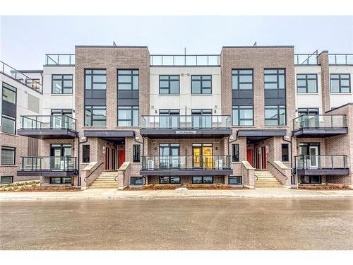 105-1577 Rose Way, Milton, ON - Outdoor With Balcony With Facade