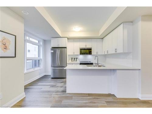 105-1577 Rose Way, Milton, ON - Indoor Photo Showing Kitchen With Stainless Steel Kitchen