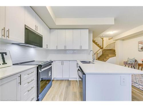 105-1577 Rose Way, Milton, ON - Indoor Photo Showing Kitchen With Double Sink With Upgraded Kitchen