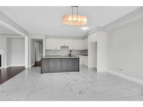 1055 Edinburgh Drive, Woodstock, ON - Indoor Photo Showing Kitchen With Fireplace