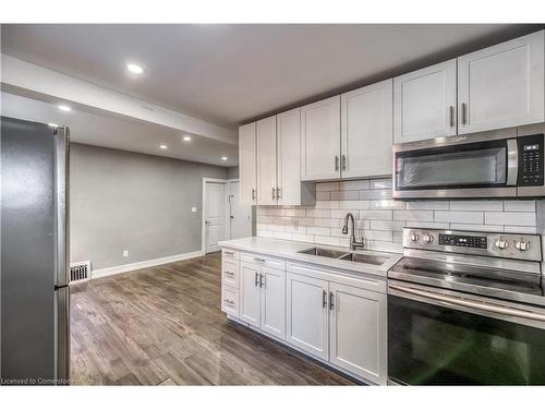 1-48 Shaw Street, Hamilton, ON - Indoor Photo Showing Kitchen With Double Sink