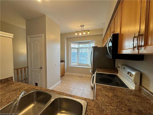 7-5080 Fairview Street, Burlington, ON - Indoor Photo Showing Kitchen With Double Sink