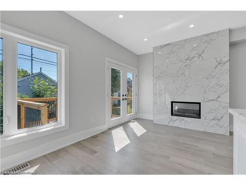 86 Beland Avenue N, Hamilton, ON - Indoor Photo Showing Living Room With Fireplace