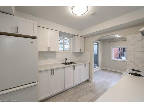 2-583 Cannon Street E, Hamilton, ON - Indoor Photo Showing Kitchen With Double Sink