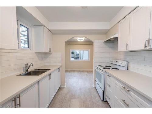 2-583 Cannon Street E, Hamilton, ON - Indoor Photo Showing Kitchen With Double Sink