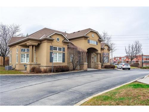 206-1830 Walkers Line, Burlington, ON - Outdoor With Facade