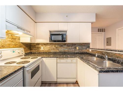 206-1830 Walkers Line, Burlington, ON - Indoor Photo Showing Kitchen With Double Sink