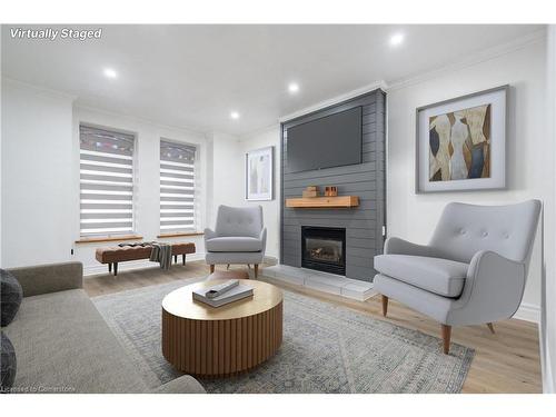 Main-106 Wentworth Street S, Hamilton, ON - Indoor Photo Showing Living Room With Fireplace