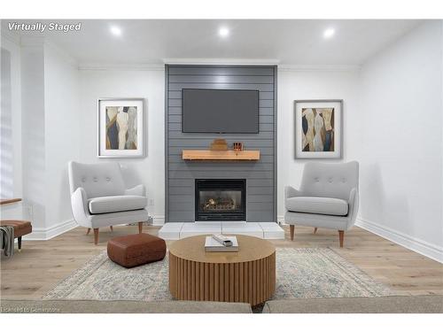 Main-106 Wentworth Street S, Hamilton, ON - Indoor Photo Showing Living Room With Fireplace