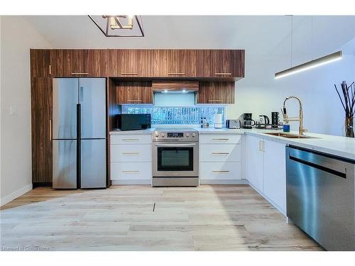 5759 Robinson Street, Niagara Falls, ON - Indoor Photo Showing Kitchen With Stainless Steel Kitchen With Double Sink