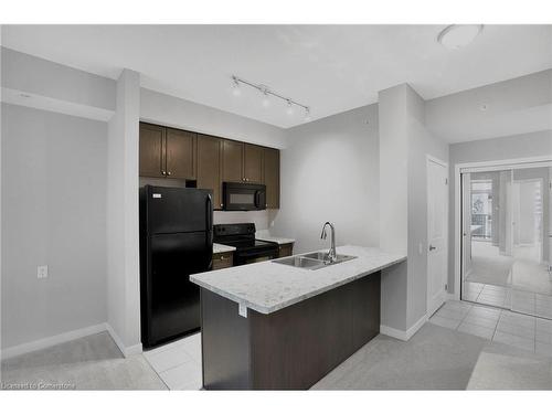 702-85 Robinson Street, Hamilton, ON - Indoor Photo Showing Kitchen With Double Sink