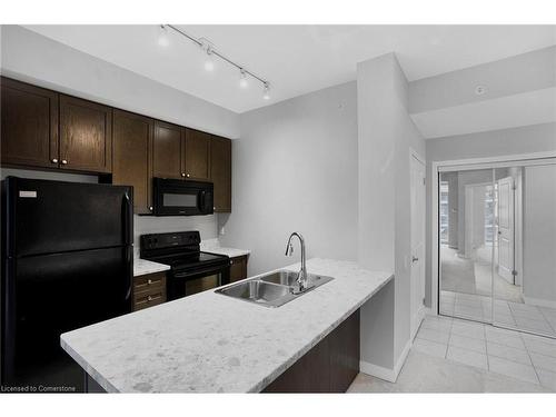 702-85 Robinson Street, Hamilton, ON - Indoor Photo Showing Kitchen With Double Sink