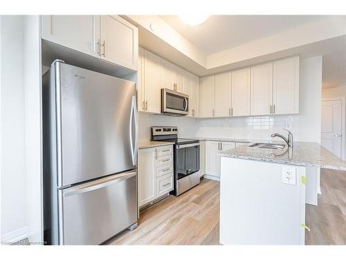 123-1577 Rose Way, Milton, ON - Indoor Photo Showing Kitchen