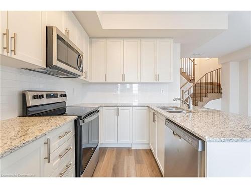 123-1577 Rose Way, Milton, ON - Indoor Photo Showing Kitchen With Double Sink With Upgraded Kitchen