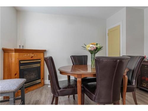 62 Alma Street, Dundas, ON - Indoor Photo Showing Dining Room With Fireplace