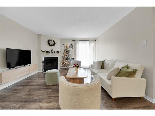 134-1496 Pilgrims Way, Oakville, ON - Indoor Photo Showing Living Room With Fireplace