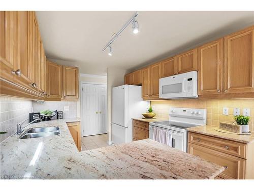 807-3000 Creekside Drive, Dundas, ON - Indoor Photo Showing Kitchen With Double Sink