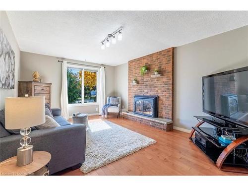 5039 Stenzel Court, Beamsville, ON - Indoor Photo Showing Living Room With Fireplace