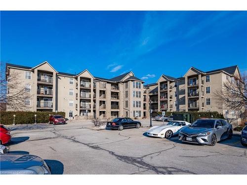 315-1451 Walker'S Line, Burlington, ON - Outdoor With Balcony With Facade