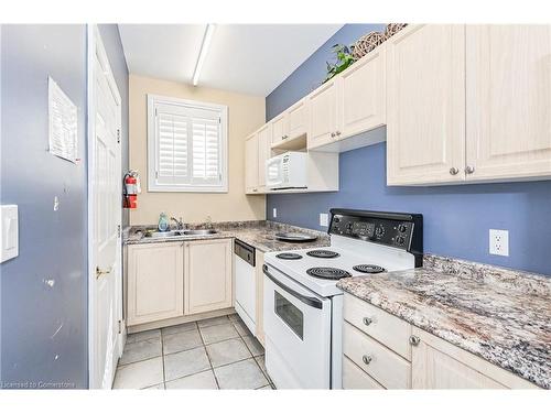 315-1451 Walker'S Line, Burlington, ON - Indoor Photo Showing Kitchen With Double Sink