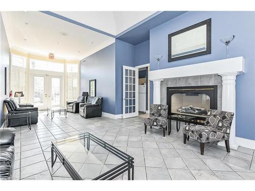 315-1451 Walker'S Line, Burlington, ON - Indoor Photo Showing Living Room With Fireplace