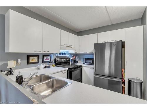 213-2030 Cleaver Avenue, Burlington, ON - Indoor Photo Showing Kitchen With Double Sink