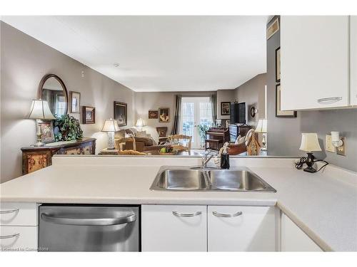 213-2030 Cleaver Avenue, Burlington, ON - Indoor Photo Showing Kitchen With Double Sink