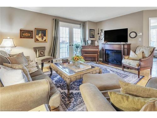 213-2030 Cleaver Avenue, Burlington, ON - Indoor Photo Showing Living Room With Fireplace