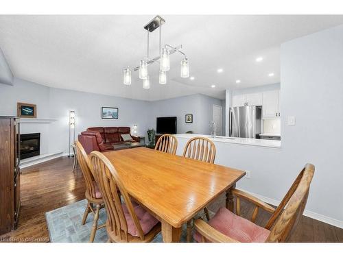 78-3333 New Street, Burlington, ON - Indoor Photo Showing Dining Room With Fireplace